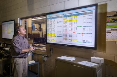 Rodon employee checks facility monitor for status
